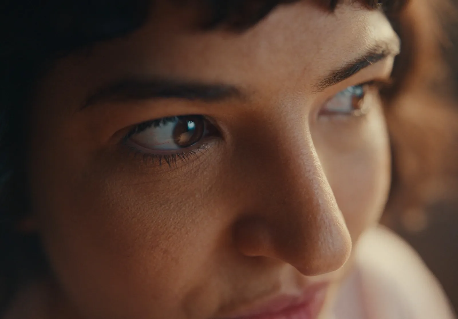 Close-up of a woman's eyes looking off frame